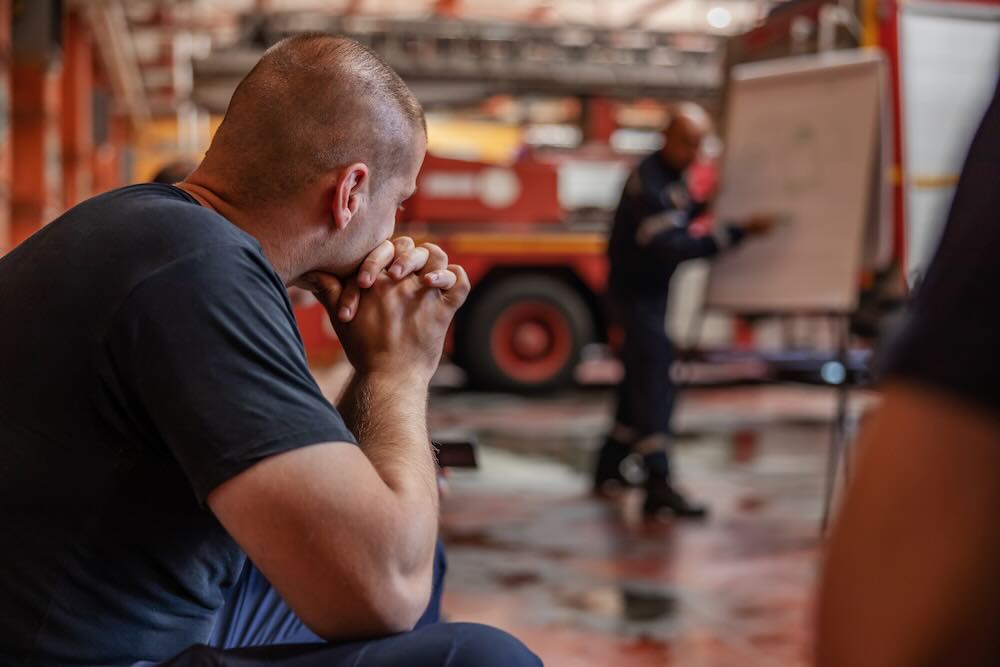 Firefighter listening to his boss
